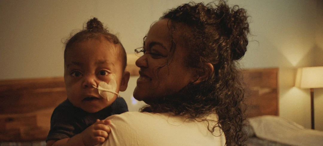 A mother holds her child