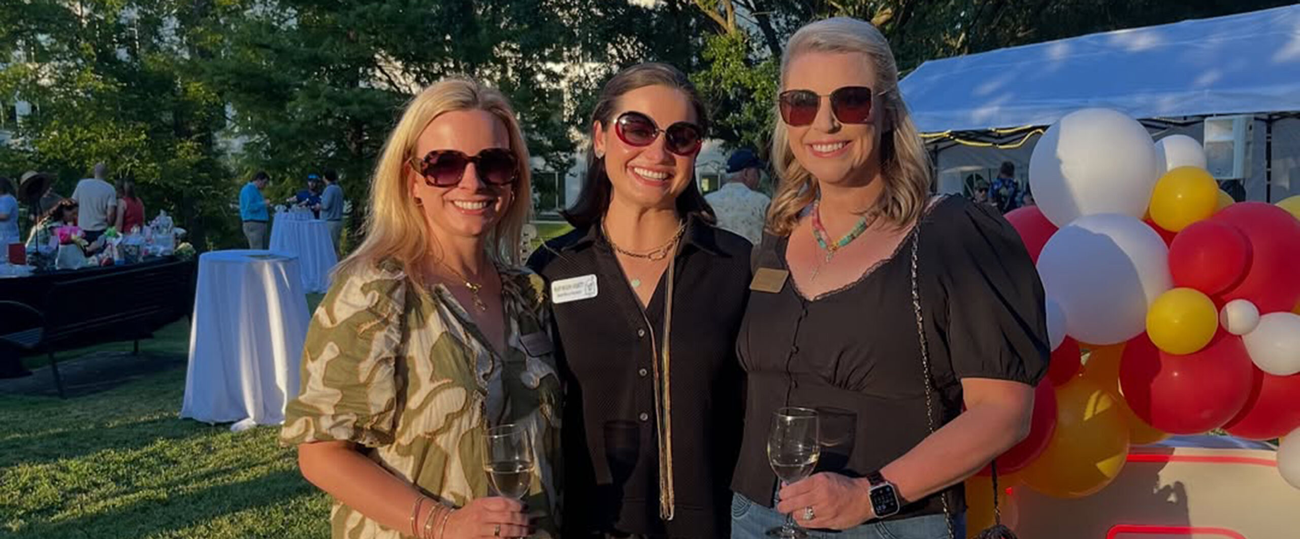 Members posing at an outdoor event.